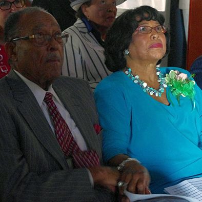 Henry and Shirley Frye watch a video made in her honor.